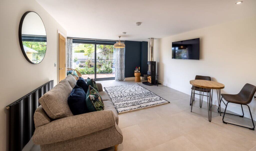 Holiday cottage living room with wood burner