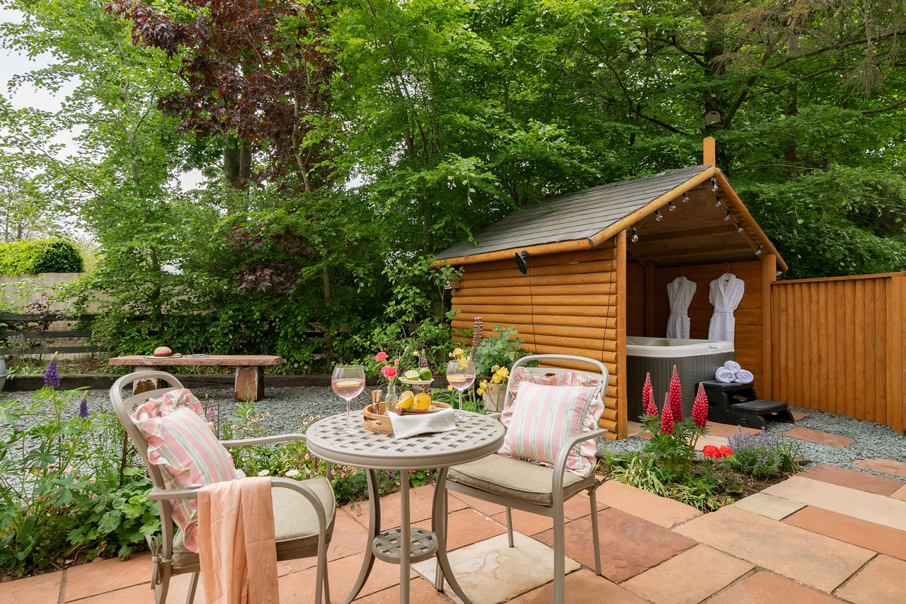 Courtyard-gardens-and-hot-tub-outside Enjoy the tranquil cottage gardens and soothing out door hot tubs
